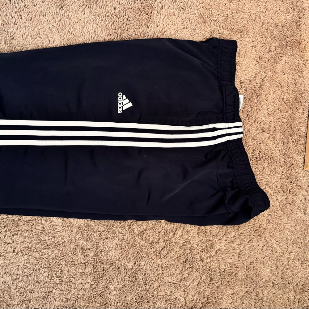 Adidas Black Sweatpants with Iconic Three Stripes